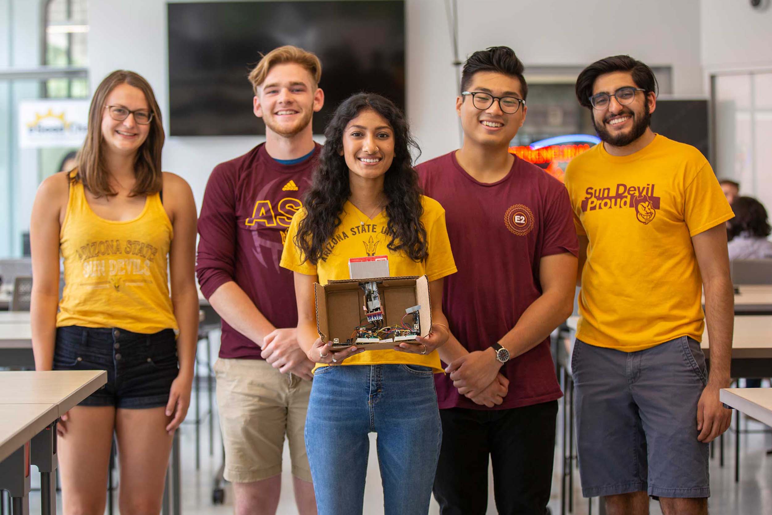 EPICS-Bridge2Africa-EG-7419a-student-resources-3x2-hero-2-crop The EPICS Bridge2Africa team stand together holding a prototype