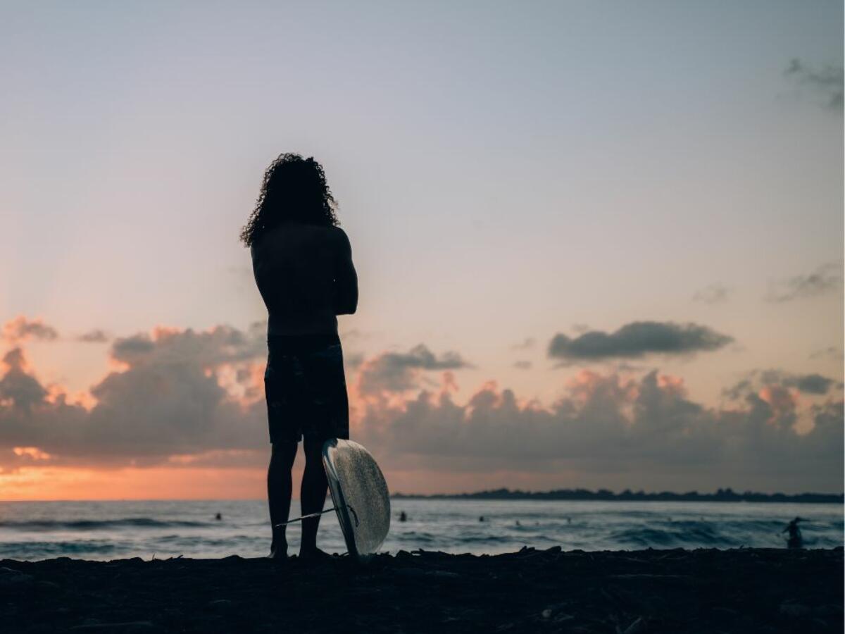 Surfer overlooking the sunset